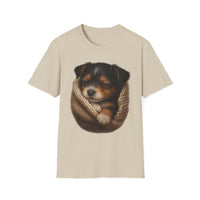 Beige t-shirt with a graphic of a dog in a knitted pouch on a white background