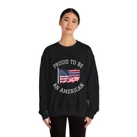 Black sweatshirt with American flag and text 'Proud to be an American' worn by a person on a white background