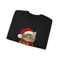 Folded black sweatshirt featuring a gray kitten wearing a Santa hat and red scarf, holding a small red gift box with a gold bow, surrounded by snowflake designs.