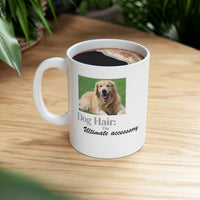 White ceramic mug featuring a photo of a smiling golden retriever lying on grass, with the humorous quote "Dog Hair: The Ultimate Accessory" printed below the image.