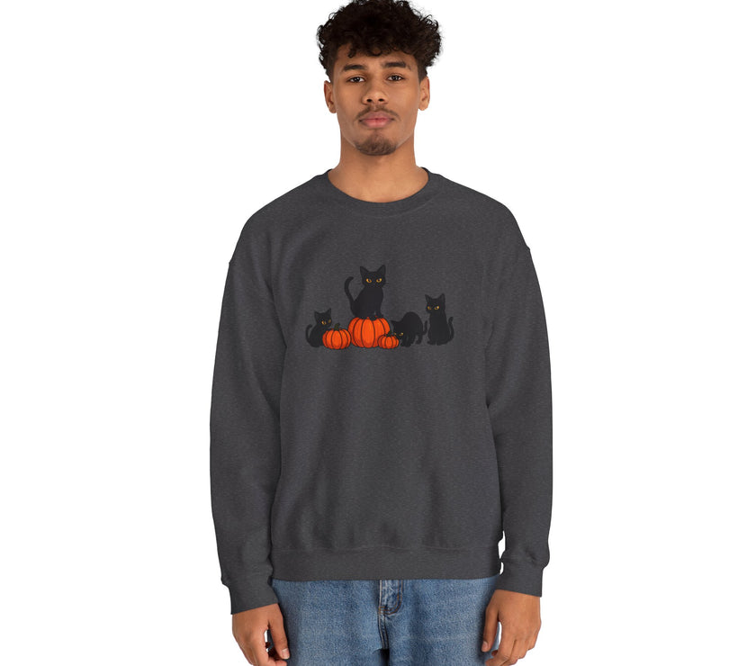 Person wearing a dark gray sweatshirt with black cats and pumpkins design on a white background