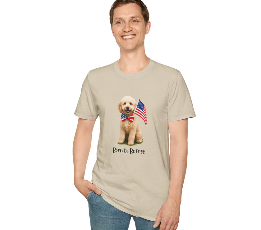 Male wearing T-shirt featuring a cute golden doodle puppy wearing an American flag bow tie and holding a small U.S. flag, with the phrase 'Born to Be Free' printed below the image.