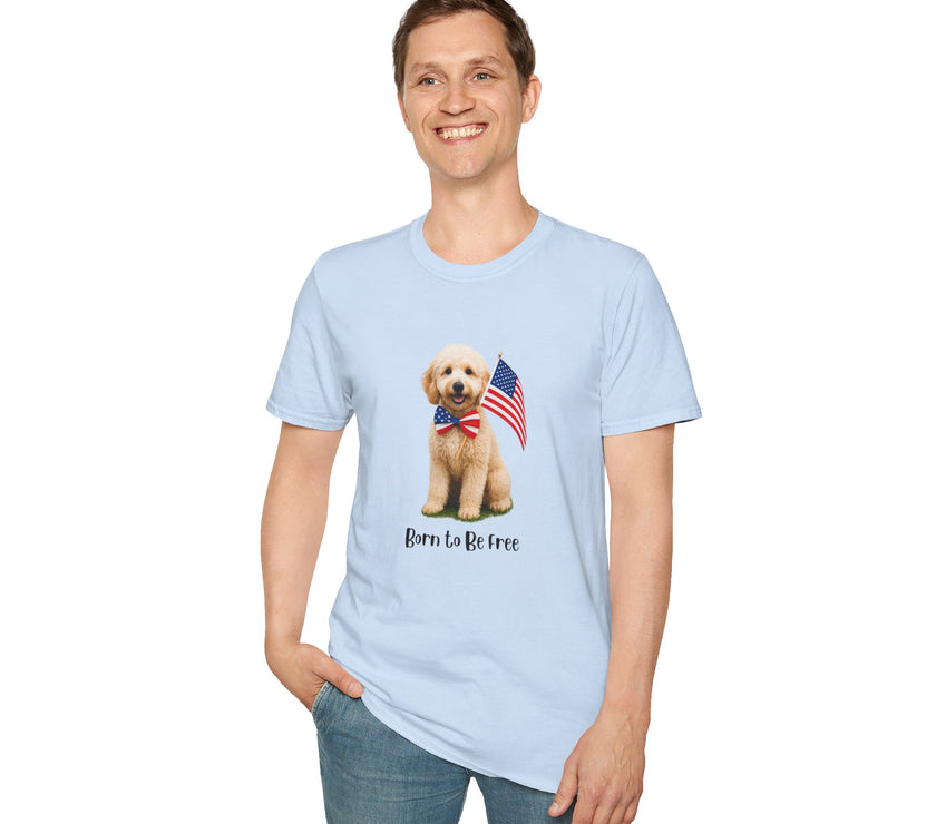Male wearing T-shirt featuring a cute golden doodle puppy wearing an American flag bow tie and holding a small U.S. flag, with the phrase 'Born to Be Free' printed below the image.