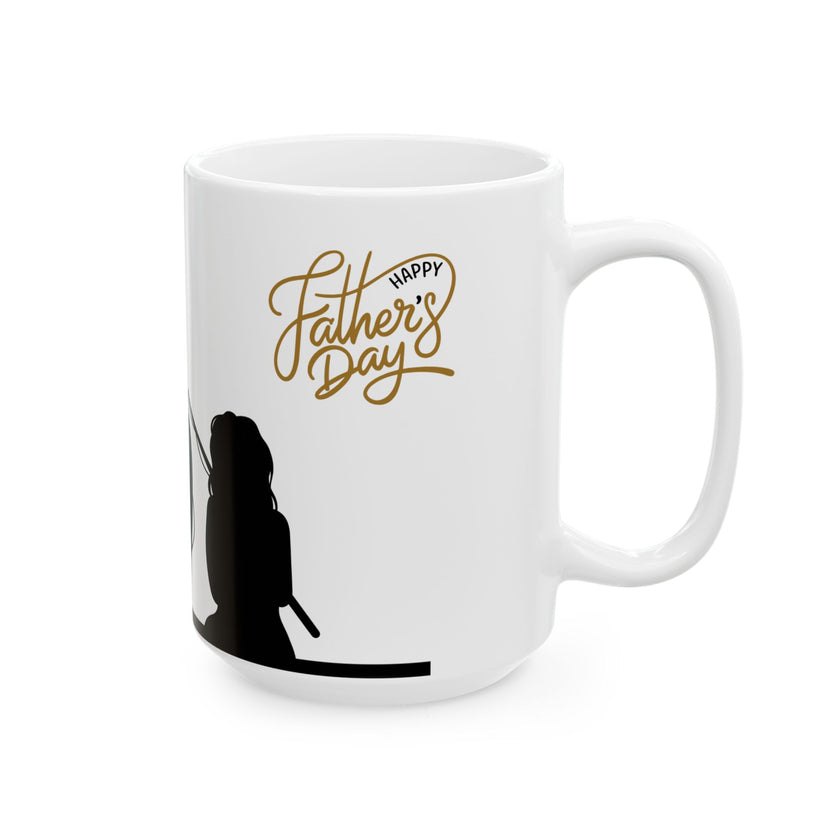 White ceramic mug featuring a silhouette of a child holding a fishing rod next to an adult figure, with the words "Happy Father's Day" in gold script above—an ideal gift for dads who love fishing and family time.