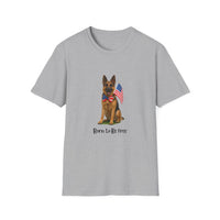 Sport Grey t-shirt featuring a patriotic German Shepherd wearing an American flag bowtie and holding U.S. flags, with the phrase "Born to Be Free" printed below — perfect for dog lovers and patriotic Americans.