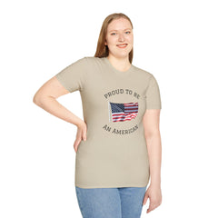 Smiling woman  wearing a white t-shirt with an American flag graphic and the words 'Proud to Be an American' printed around the flag