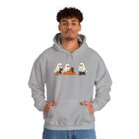 Person wearing a gray hoodie with Halloween-themed design on a white background