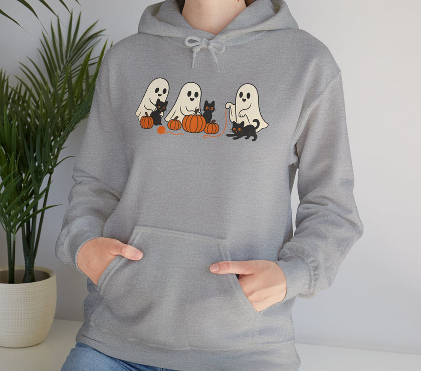 Person wearing a gray hoodie with Halloween-themed design featuring ghosts, cats, and pumpkins.