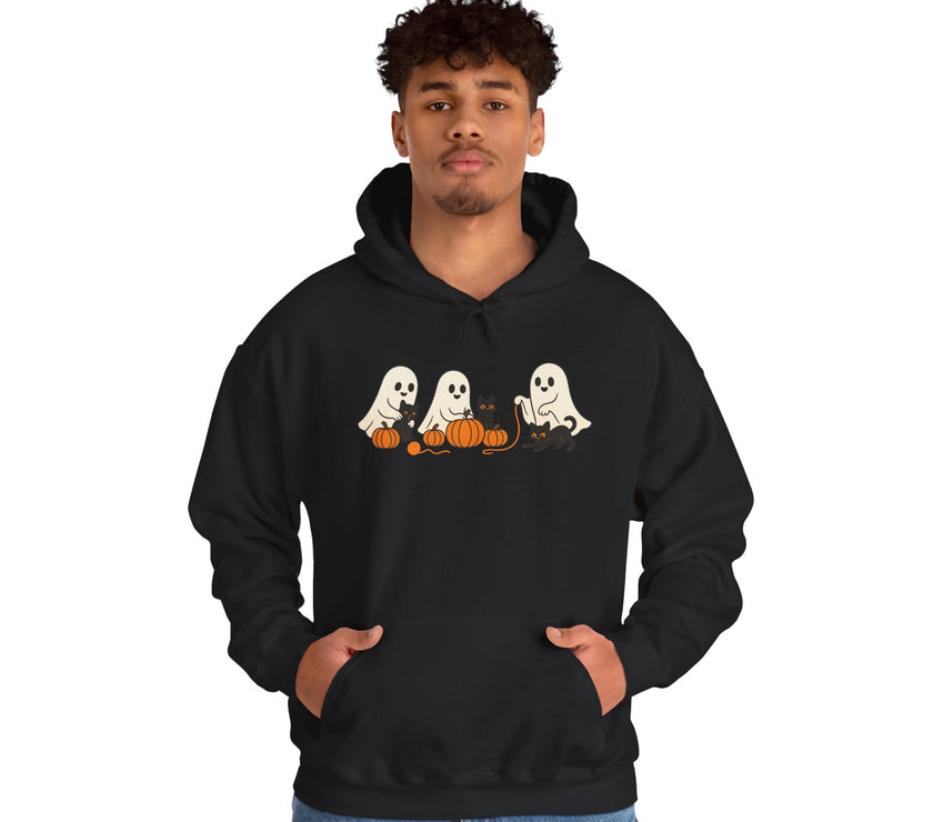 Person wearing a black hoodie with Halloween-themed design on a white background
