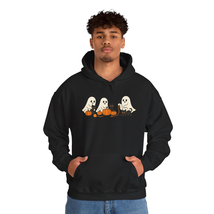 Person wearing a black hoodie with Halloween-themed design on a white background