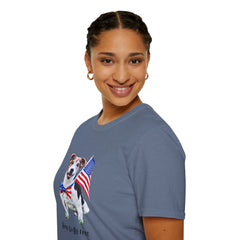 Female wearing T-shirt featuring a cute  puppy wearing an American flag bow tie and holding a small U.S. flag, with the phrase 'Born to Be Free' printed below the image.