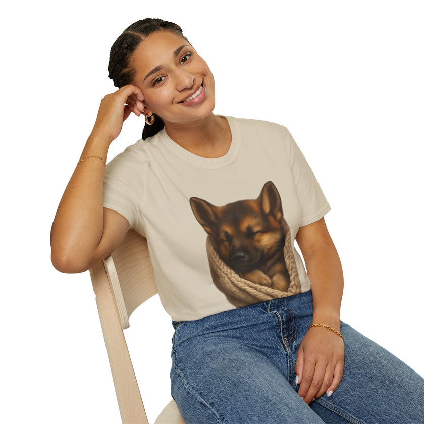 Woman wearing a t-shirt with a dog graphic design, sitting on a chair.