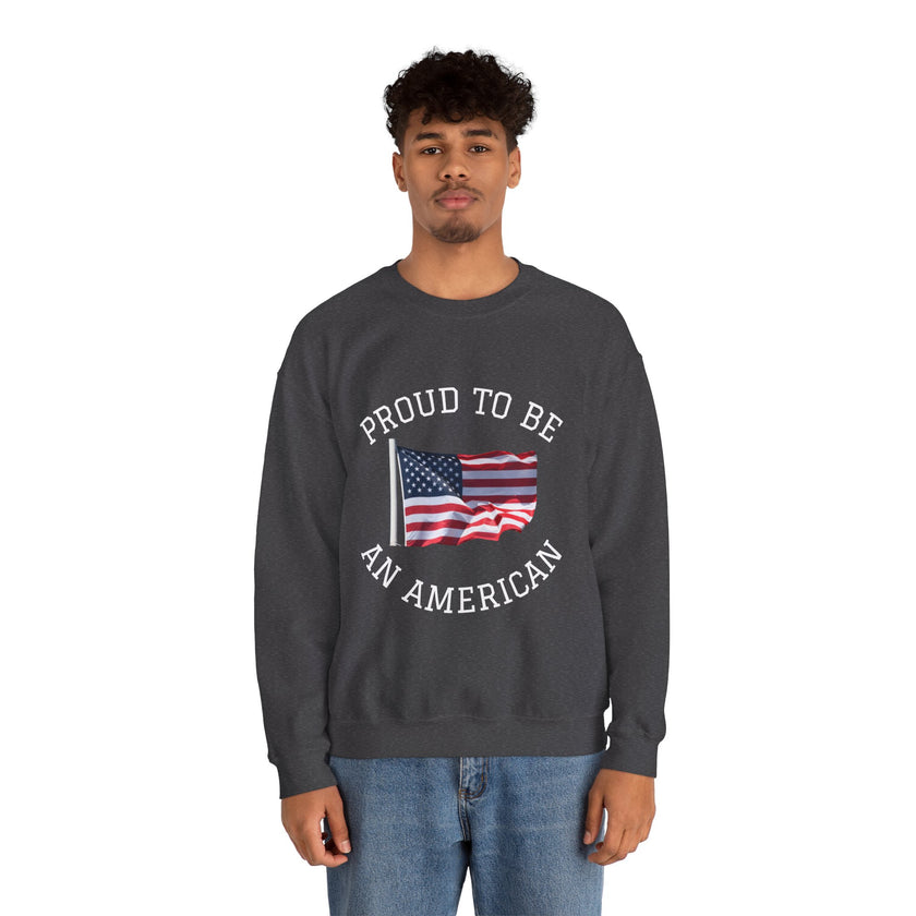Person wearing a dark gray sweatshirt with 'Proud to be an American' text and an American flag graphic on a white background.