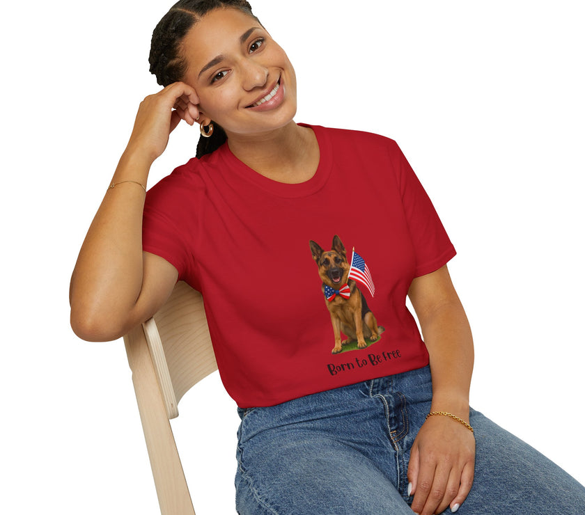 Cherry Red t-shirt featuring a patriotic German Shepherd wearing an American flag bowtie and holding U.S. flags, with the phrase "Born to Be Free" printed below — perfect for dog lovers and patriotic Americans.