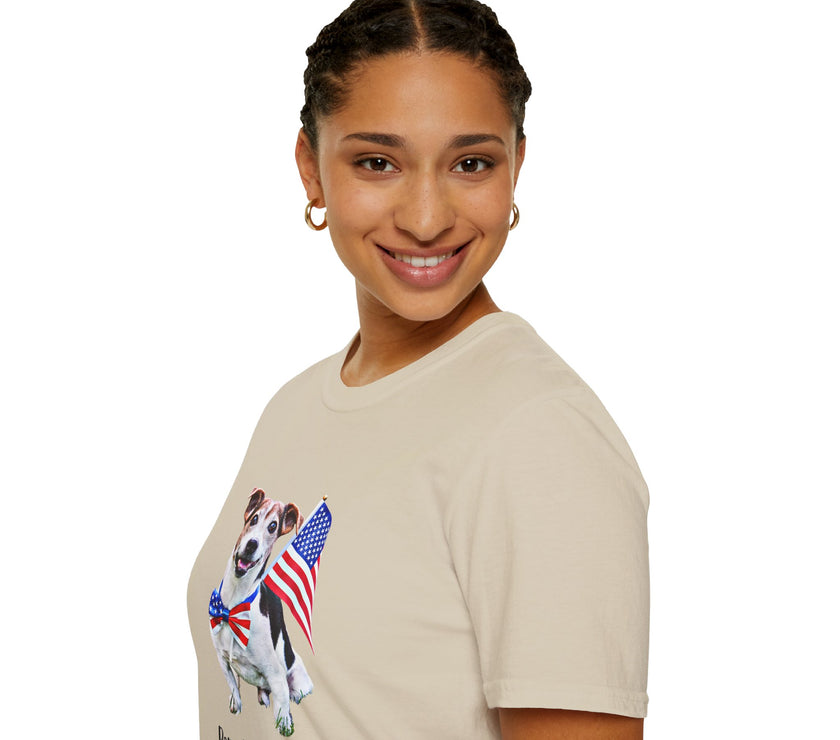 Female wearing T-shirt featuring a cute  puppy wearing an American flag bow tie and holding a small U.S. flag, with the phrase 'Born to Be Free' printed below the image.