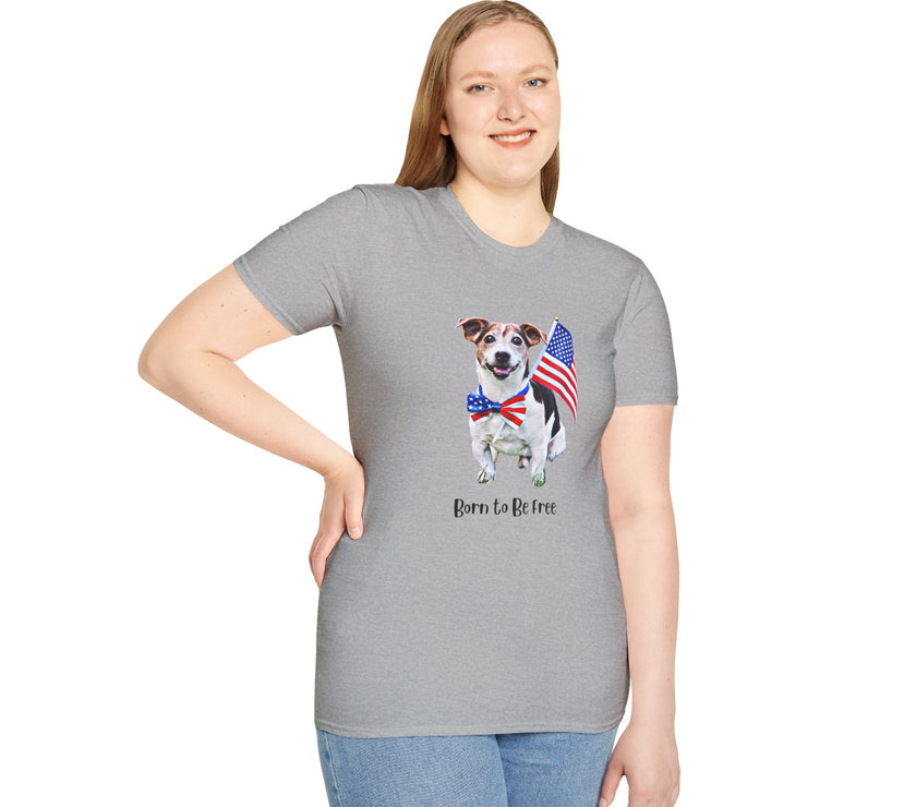 Female wearing T-shirt featuring a cute  puppy wearing an American flag bow tie and holding a small U.S. flag, with the phrase 'Born to Be Free' printed below the image.
