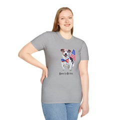 Female wearing T-shirt featuring a cute  puppy wearing an American flag bow tie and holding a small U.S. flag, with the phrase 'Born to Be Free' printed below the image.