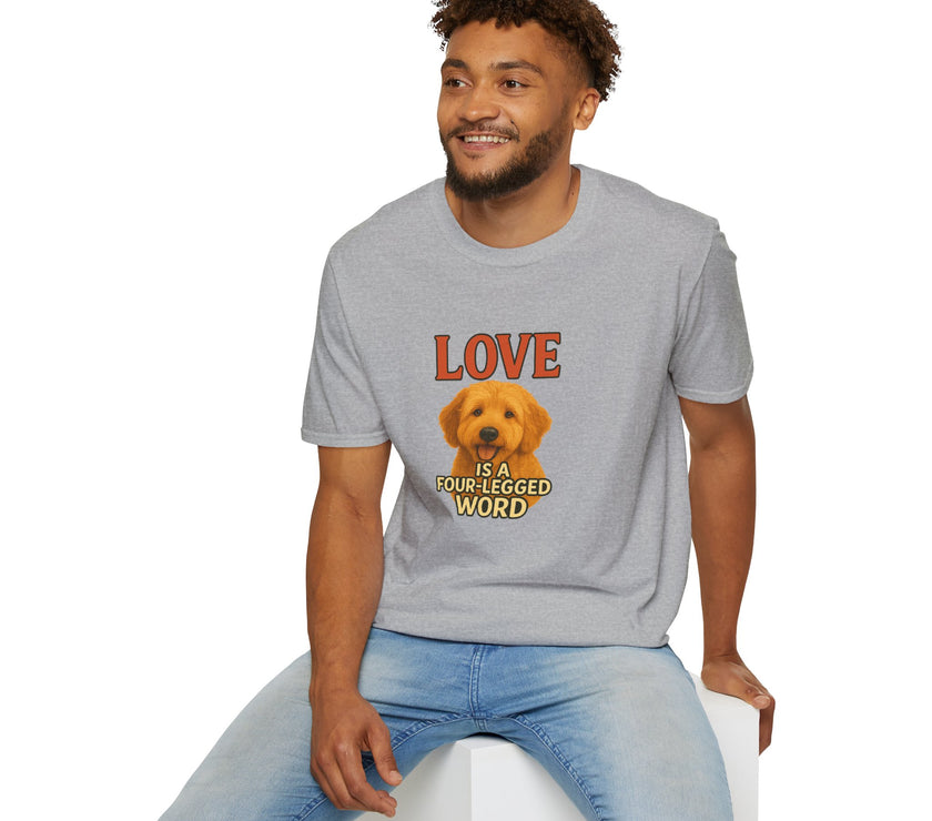 Man wearing a gray t-shirt with a dog graphic and text, sitting on a white stool against a white background.