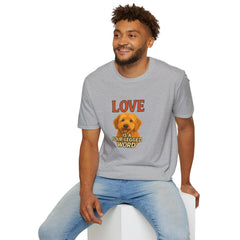 Man wearing a gray t-shirt with a dog graphic and text, sitting on a white stool against a white background.