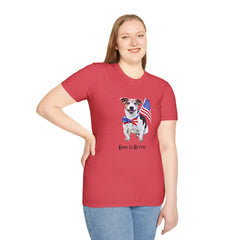 Female wearing T-shirt featuring a cute  puppy wearing an American flag bow tie and holding a small U.S. flag, with the phrase 'Born to Be Free' printed below the image.