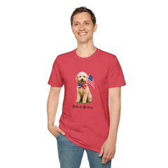 Male wearing T-shirt featuring a cute golden doodle puppy wearing an American flag bow tie and holding a small U.S. flag, with the phrase 'Born to Be Free' printed below the image.