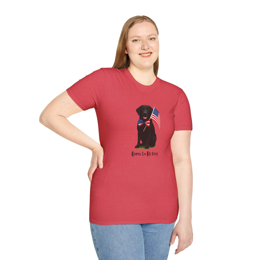 Heather Red  t-shirt featuring a patriotic Black Lab wearing an American flag bowtie and holding U.S. flags, with the Black Lab phrase "Born to Be Free" printed below — perfect for dog lovers and patriotic Americans.