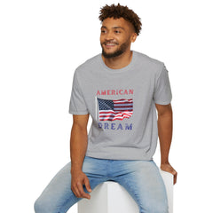Male wearing T-shirt featuring an American flag graphic with the words 'AMERICAN DREAM' in red and blue text above and below the flag