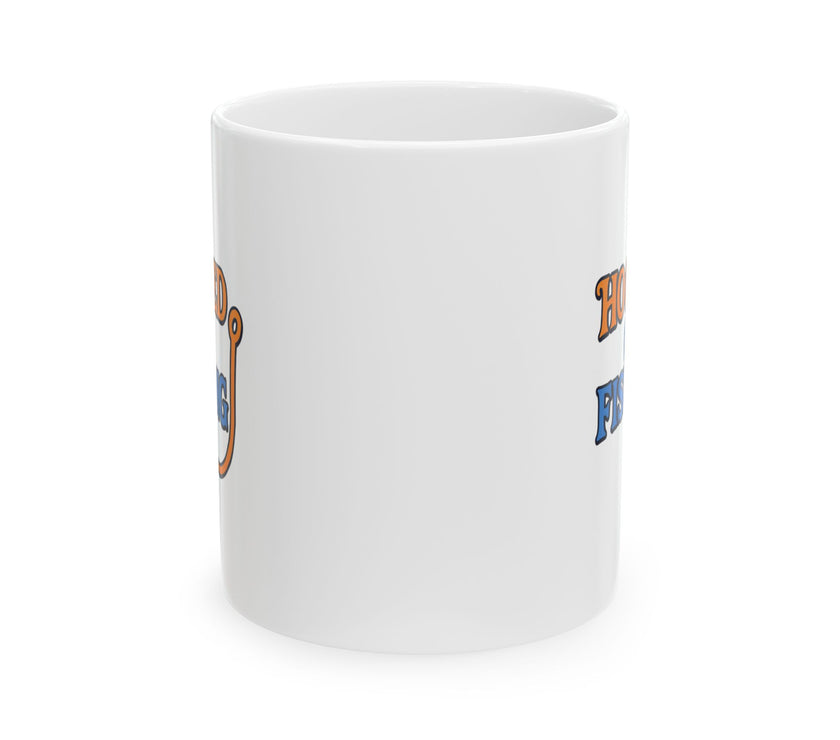 A white ceramic coffee mug displayed against a plain background, featuring the phrase "Hooked on Fishing" in bold orange and blue text with a graphic of a fishing hook integrated into the design.  Front view