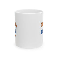 A white ceramic coffee mug displayed against a plain background, featuring the phrase "Hooked on Fishing" in bold orange and blue text with a graphic of a fishing hook integrated into the design.  Front view