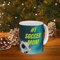 Mug with '#1 Soccer Mom' text and soccer ball design on a teal background