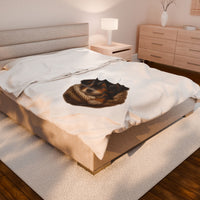 Blanket with Puppy wrapped in a knitted blanket on a white 