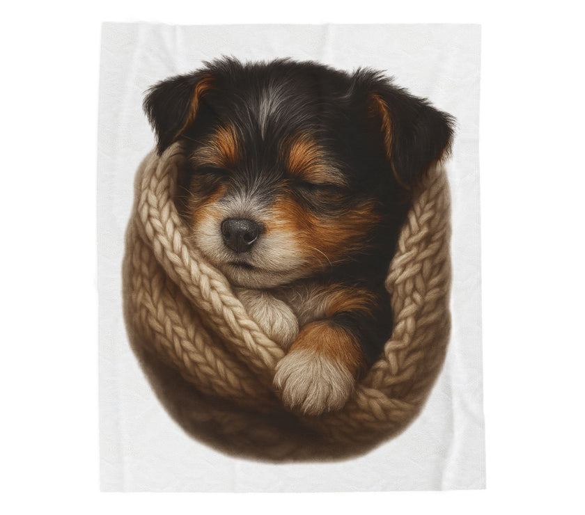 Blanket with Puppy wrapped in a knitted blanket on a white background