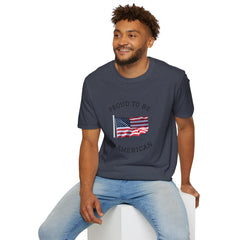 Young man  wearing a white t-shirt with an American flag graphic and the words 'Proud to Be an American' printed around the flag