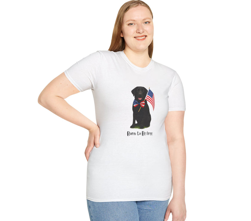 White t-shirt featuring a patriotic Black Lab wearing an American flag bowtie and holding U.S. flags, with the Black Labphrase "Born to Be Free" printed below — perfect for dog lovers and patriotic Americans.