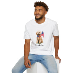 Male wearing T-shirt featuring a cute golden doodle puppy wearing an American flag bow tie and holding a small U.S. flag, with the phrase 'Born to Be Free' printed below the image.