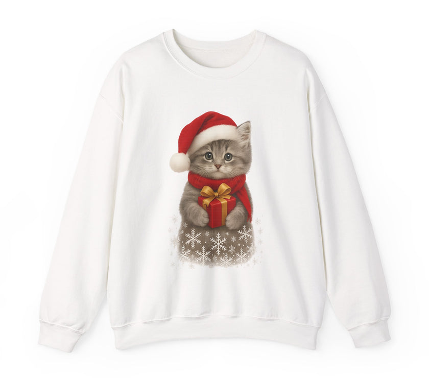 White sweatshirt featuring a gray kitten wearing a Santa hat and red scarf, holding a small red gift box with a gold bow, surrounded by snowflake designs.