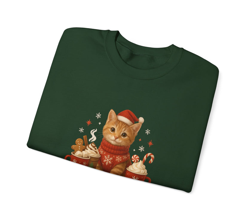 Folded green sweatshirt with a Christmas-themed cat design on a white background