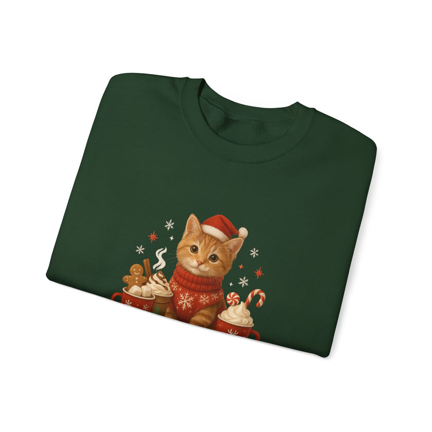 Folded green sweatshirt with a Christmas-themed cat design on a white background