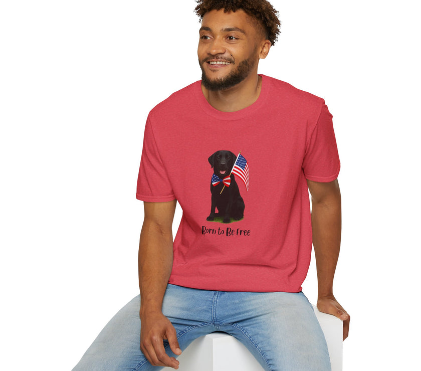 Heather Red  t-shirt featuring a patriotic Black Lab wearing an American flag bowtie and holding U.S. flags, with the Black Lab phrase "Born to Be Free" printed below — perfect for dog lovers and patriotic Americans.