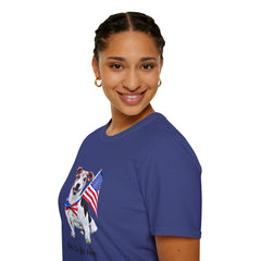 Female wearing T-shirt featuring a cute  puppy wearing an American flag bow tie and holding a small U.S. flag, with the phrase 'Born to Be Free' printed below the image.