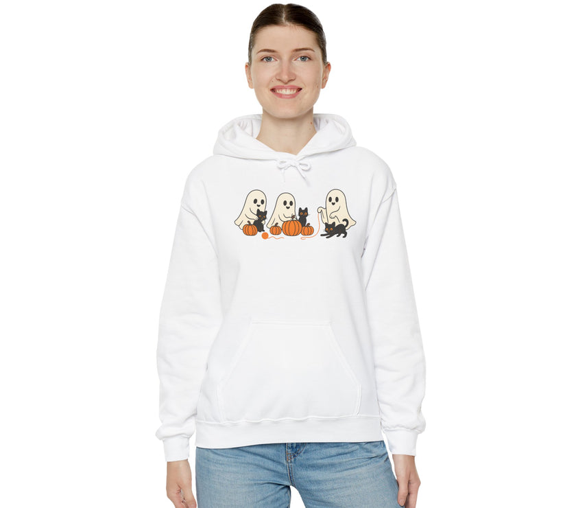 Person wearing a white hoodie with Halloween-themed design on a white background