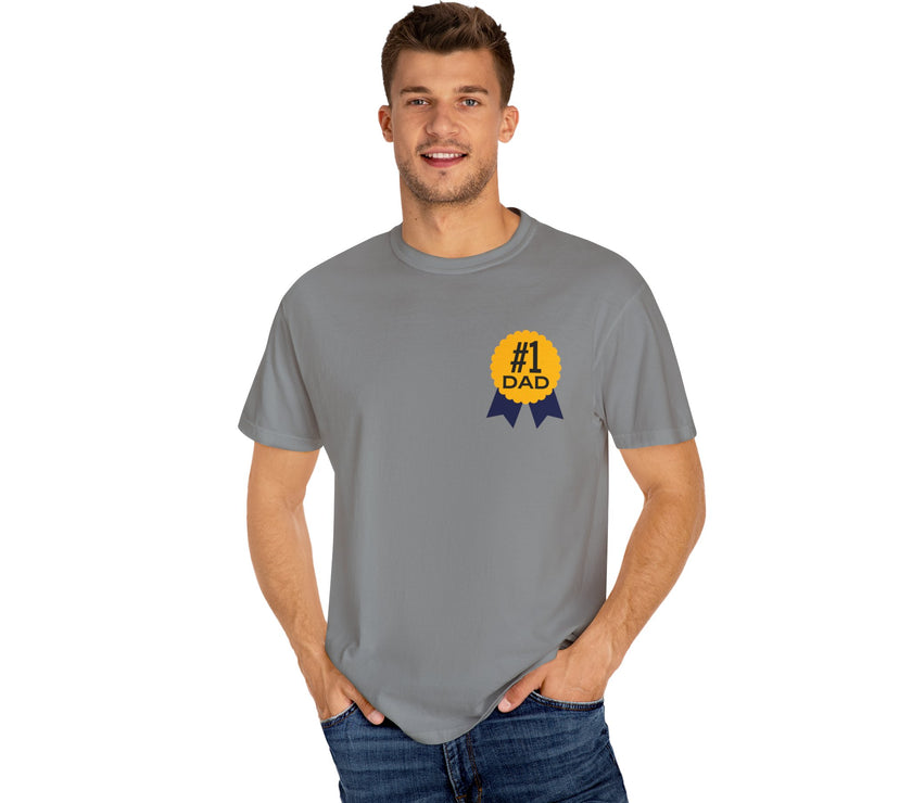 Gray t-shirt featuring a yellow and navy blue award ribbon graphic on the chest with the text "#1 Dad," designed as a fun and heartfelt Father's Day gift.