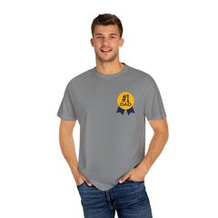 Gray t-shirt featuring a yellow and navy blue award ribbon graphic on the chest with the text "#1 Dad," designed as a fun and heartfelt Father's Day gift.