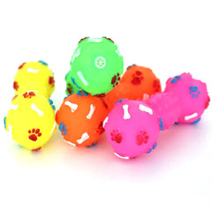 Colorful dog toys with paw and bone patterns on a white background
