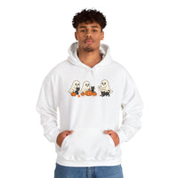Person wearing a white hoodie with Halloween-themed design on a white background