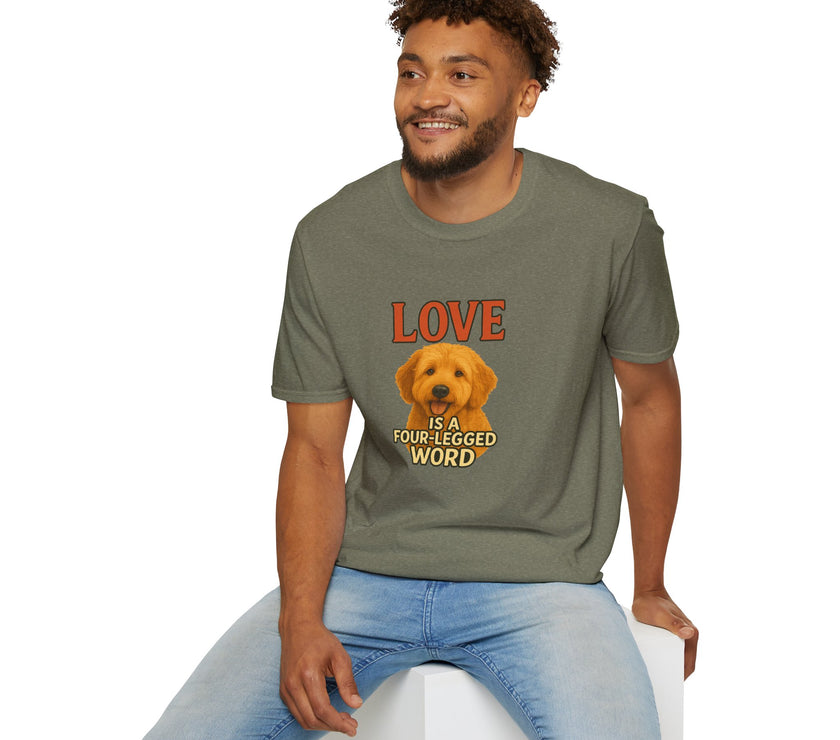 Man wearing a green t-shirt with a dog graphic and text, sitting on a white stool against a white background.