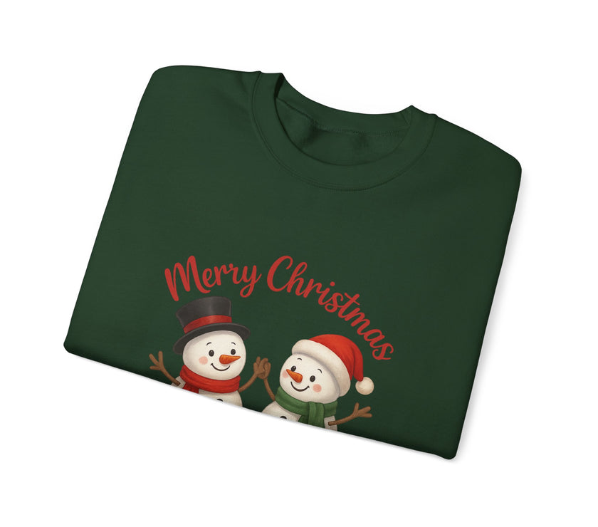 Folded green Christmas sweater with snowmen and 'Merry Christmas' text on a white background