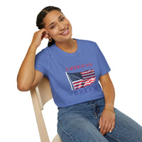 Female wearing T-shirt featuring an American flag graphic with the words 'AMERICAN DREAM' in red and blue text above and below the flag