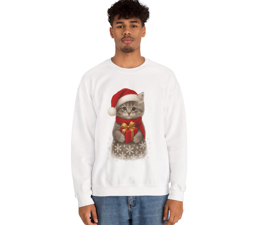 White sweatshirt featuring a gray kitten wearing a Santa hat and red scarf, holding a small red gift box with a gold bow, surrounded by snowflake designs.