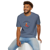 Man wearing a blue t-shirt with a graphic design sitting on a white stool against a white background